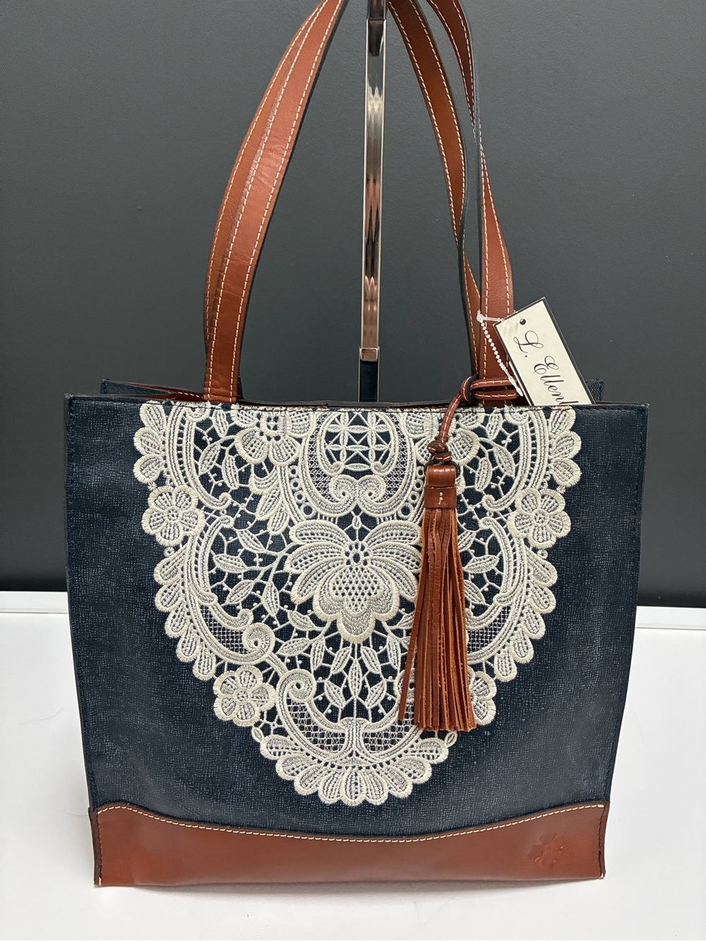 Patricia Nash. NWT Navy Tote with Lace Appliqué and Brown Leather Trim